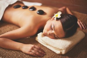 woman enjoying stone massage